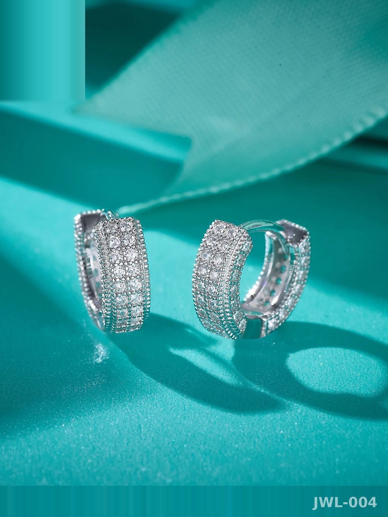 Iced Out Hoop Earrings · 3-Row Pavé · 925 Silver · D Color VVS Moissanite