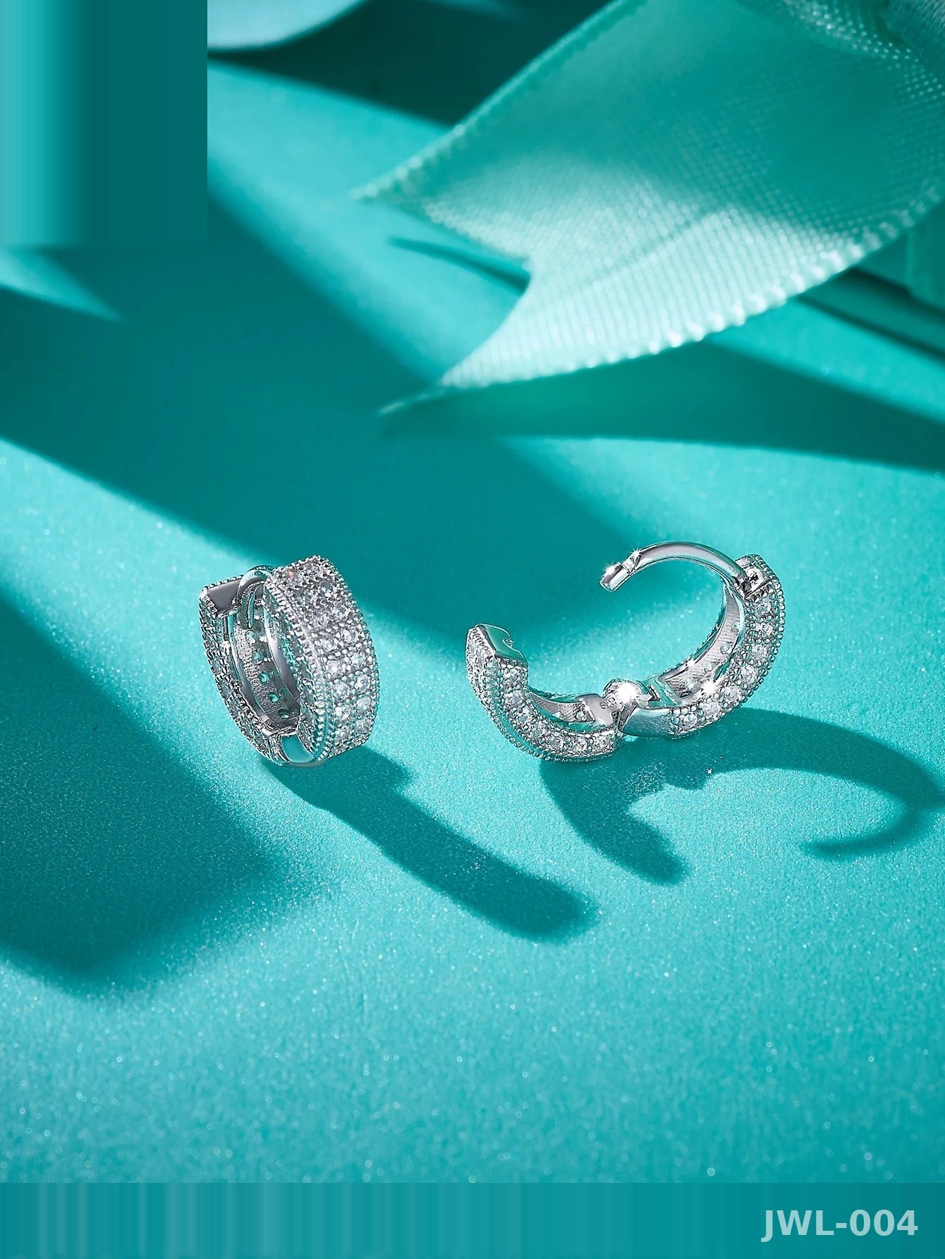 Iced Out Hoop Earrings · 3-Row Pavé · 925 Silver · D Color VVS Moissanite